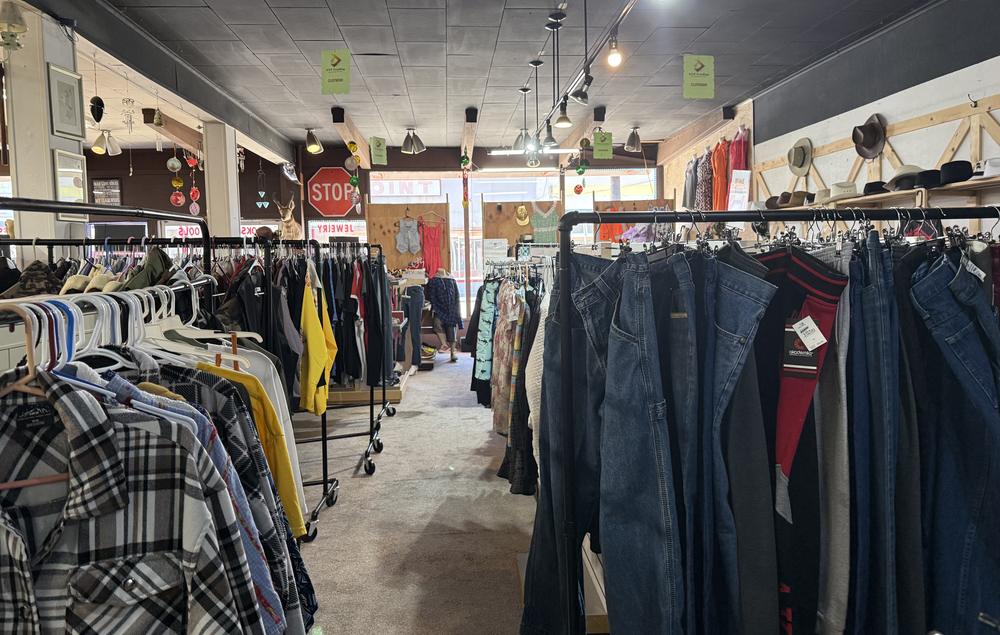 Racks of jeans, flannels and jackets in the DTF Trading clothing aisle
